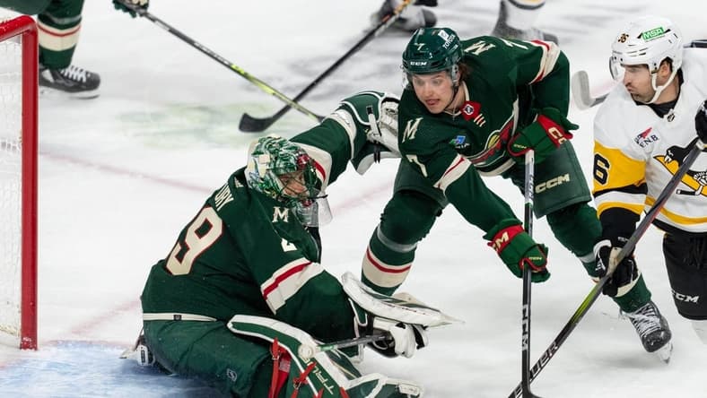 Feb 9, 2024; Saint Paul, Minnesota, USA; Minnesota Wild goaltender Marc-Andre Fleury (29) makes a save as Pittsburgh Penguins center Colin White (36) looks for a rebound in the second period at Xcel Energy Center. Mandatory Credit: Matt Blewett-USA TODAY Sports