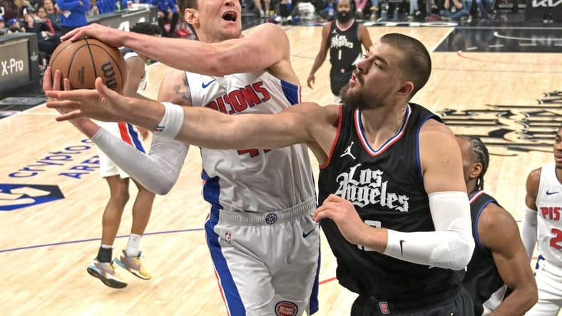 Feb 10, 2024; Los Angeles, California, USA; Detroit Pistons center Mike Muscala (41) reaches in front of Los Angeles Clippers center Ivica Zubac (40) for a rebound in the first half at Crypto.com Arena. Mandatory Credit: Jayne Kamin-Oncea-USA TODAY Sports