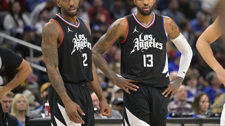 Feb 10, 2024; Los Angeles, California, USA;   Los Angeles Clippers forward Kawhi Leonard (2) and forward Paul George (13) look on in the second half against the Detroit Pistons at Crypto.com Arena. Mandatory Credit: Jayne Kamin-Oncea-USA TODAY Sports