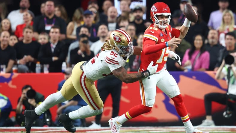 Feb 11, 2024; Paradise, Nevada, USA; Kansas City Chiefs quarterback Patrick Mahomes (15) is pressured by San Francisco 49ers defensive end Chase Young (92) in the first half in Super Bowl LVIII at Allegiant Stadium. Mandatory Credit: Mark J. Rebilas-USA TODAY Sports