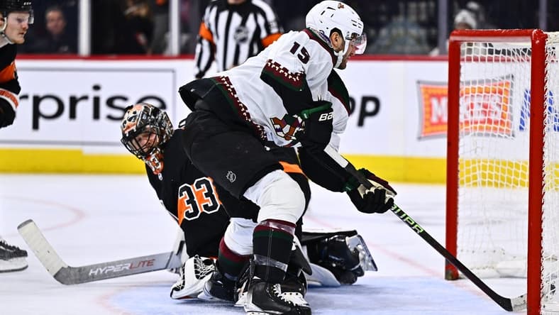 Feb 12, 2024; Philadelphia, Pennsylvania, USA; Arizona Coyotes center Alex Kerfoot (15) scores a goal against Philadelphia Flyers goalie Samuel Ersson (33) in the second period at Wells Fargo Center. Mandatory Credit: Kyle Ross-USA TODAY Sports