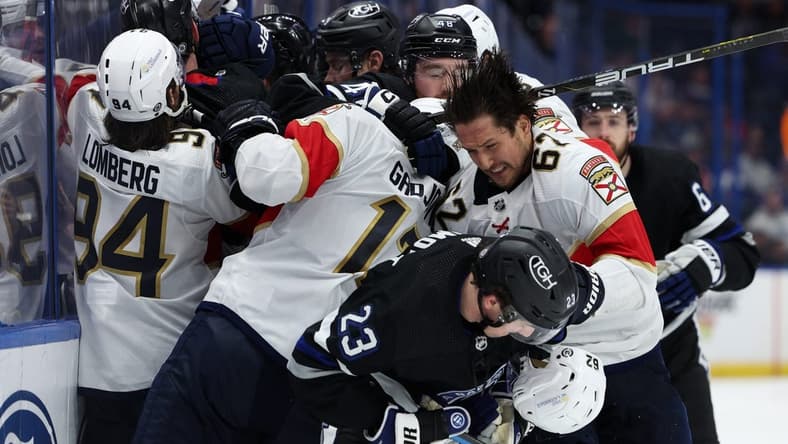 Feb 17, 2024; Tampa, Florida, USA;  the Tampa Bay Lightning and Florida Panthers scuffle on the boards in the third period at Amalie Arena. Mandatory Credit: Nathan Ray Seebeck-USA TODAY Sports