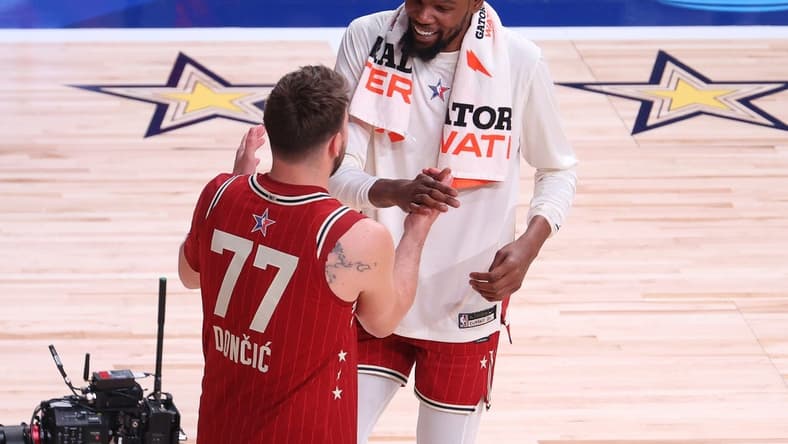Feb 18, 2024; Indianapolis, Indiana, USA; Western Conference forward Luka Doncic (77) of the Dallas Mavericks shakes hands with forward Kevin Durant (35) of the Phoenix Suns following the 73rd NBA All Star game against the Eastern Conference All-Stars at Gainbridge Fieldhouse. Mandatory Credit: Trevor Ruszkowski-USA TODAY Sports
