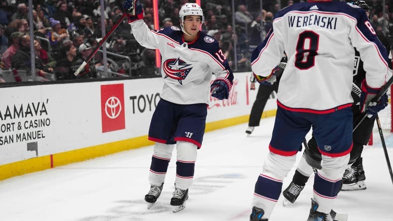 Feb 20, 2024; Los Angeles, California, USA; Columbus Blue Jackets left wing Johnny Gaudreau (13) celebrates with defenseman Zach Werenski (8) against the LA Kings in the first period at Crypto.com Arena. Mandatory Credit: Kirby Lee-USA TODAY Sports
