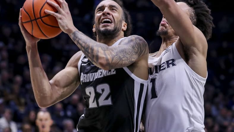 Feb 21, 2024; Cincinnati, Ohio, USA; Providence Friars guard Devin Carter (22) drives to the basket against Xavier Musketeers guard Desmond Claude (1) in the second half at Cintas Center. Mandatory Credit: Katie Stratman-USA TODAY Sports