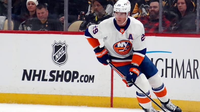 Feb 20, 2024; Pittsburgh, Pennsylvania, USA;  New York Islanders center Brock Nelson (29) moves the puck against the Pittsburgh Penguins during the first period at PPG Paints Arena. Mandatory Credit: Charles LeClaire-USA TODAY Sports