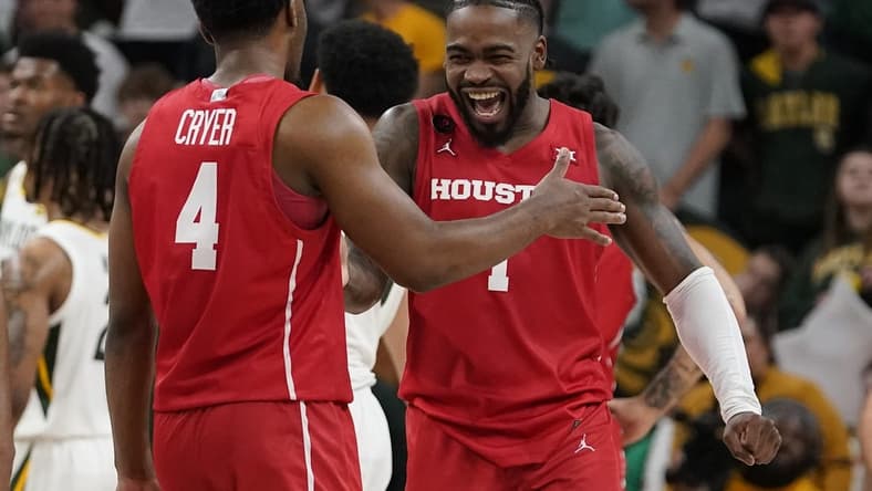 Feb 24, 2024; Waco, Texas, USA; Houston Cougars guard L.J. Cryer (4) and guard Jamal Shead (1) react in the closing moments of overtime against the Baylor Bears at Paul and Alejandra Foster Pavilion. Mandatory Credit: Raymond Carlin III-USA TODAY Sports