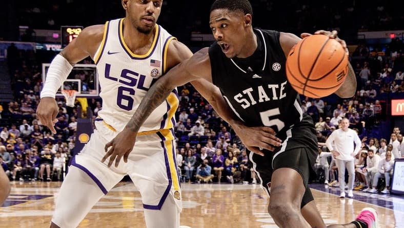 Feb 24, 2024; Baton Rouge, Louisiana, USA; Mississippi State Bulldogs guard Shawn Jones Jr. (5) drives to the basket against LSU Tigers guard Jordan Wright (6) during the second half at Pete Maravich Assembly Center. Mandatory Credit: Stephen Lew-USA TODAY Sports