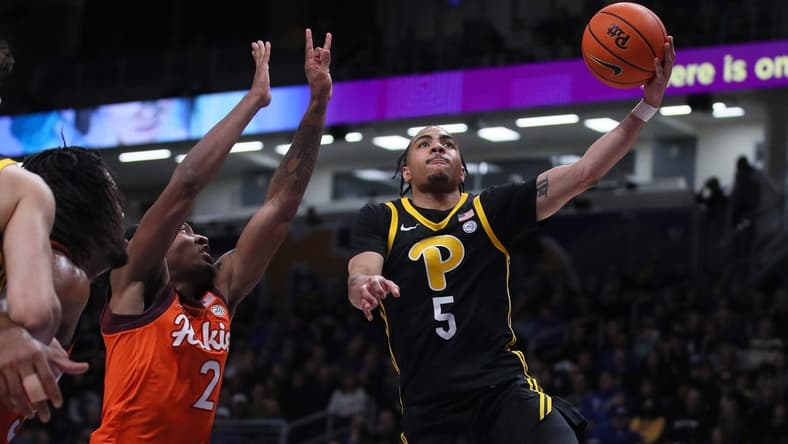 Pittsburgh Panthers Ishmael Leggett (5) goes for a layup after getting around Virginia Tech Hokies MJ Collins (2) during the first half on February 24, 2024 at the Petersen Events Center in Pittsburgh, PA.