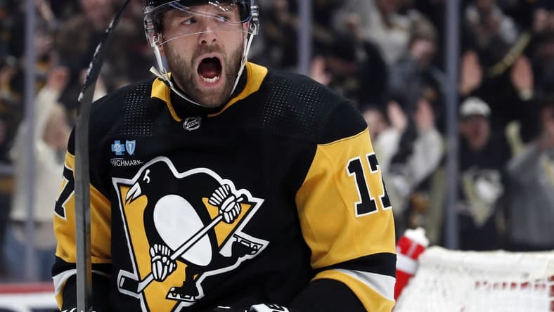 Feb 25, 2024; Pittsburgh, Pennsylvania, USA; Pittsburgh Penguins right wing Bryan Rust (17) reacts after scoring his second goal of the game against the Philadelphia Flyers during the second period at PPG Paints Arena. Mandatory Credit: Charles LeClaire-USA TODAY Sports