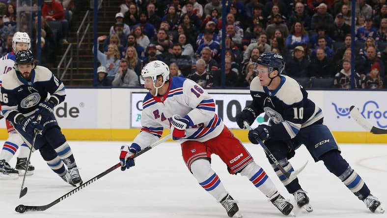 Feb 25, 2024; Columbus, Ohio, USA; New York Rangers center Vincent Trocheck (16) carries the puck as Columbus Blue Jackets left wing Dmitri Voronkov (10) trails the play during the first period at Nationwide Arena. Mandatory Credit: Russell LaBounty-USA TODAY Sports