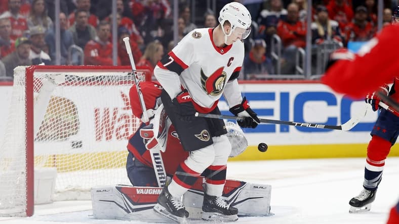 Feb 26, 2024; Washington, District of Columbia, USA; Washington Capitals goaltender Darcy Kuemper (35) makes a save on a deflection by Ottawa Senators left wing Brady Tkachuk (7) in the second period at Capital One Arena. Mandatory Credit: Geoff Burke-USA TODAY Sports