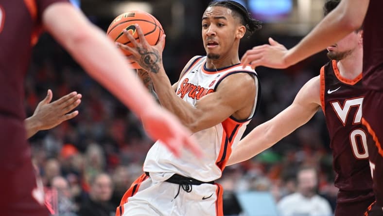 Feb 27, 2024; Syracuse, New York, USA; Syracuse Orange guard Judah Mintz handles the ball in traffic against the Virginia Tech Hokies in the second half at the JMA Wireless Dome. Mandatory Credit: Mark Konezny-USA TODAY Sports