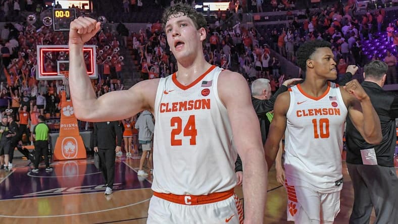 Feb 27, 2024; Clemson, South Carolina, USA; Clemson junior forward PJ Hall (24) and RJ Godfrey (10) celebrate after the Tigers beat Pitt 69-62 at Littlejohn Coliseum. Mandatory Credit: Ken Ruinard-USA TODAY Sports