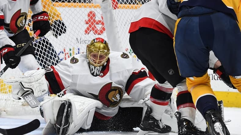 Feb 27, 2024; Nashville, Tennessee, USA; Ottawa Senators goaltender Joonas Korpisalo (70) makes a save during the third period against the Nashville Predators at Bridgestone Arena. Mandatory Credit: Christopher Hanewinckel-USA TODAY Sports