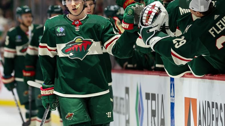 Feb 27, 2024; Saint Paul, Minnesota, USA; Minnesota Wild center Connor Dewar (26) celebrates his goal against the Carolina Hurricanes during the first period at Xcel Energy Center. Mandatory Credit: Matt Krohn-USA TODAY Sports