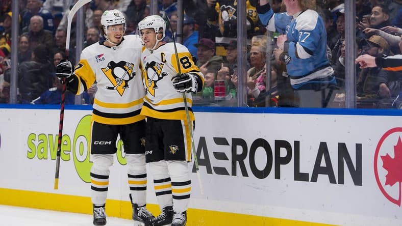 Feb 27, 2024; Vancouver, British Columbia, CAN; Pittsburgh Penguins forward Rickard Rakell (67) and forward Sidney Crosby (87) celebrate Rakell s second goal of the game against the Vancouver Canucks in the second period at Rogers Arena. Mandatory Credit: Bob Frid-USA TODAY Sports