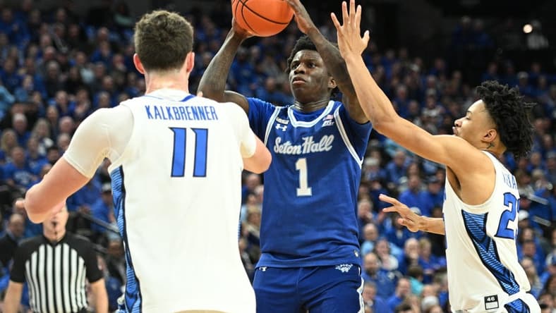 Feb 28, 2024; Omaha, Nebraska, USA; Seton Hall Pirates guard Kadary Richmond (1) shoots over Creighton Bluejays center Ryan Kalkbrenner (11) and guard Trey Alexander (23) in the first half at CHI Health Center Omaha. Mandatory Credit: Steven Branscombe-USA TODAY Sports