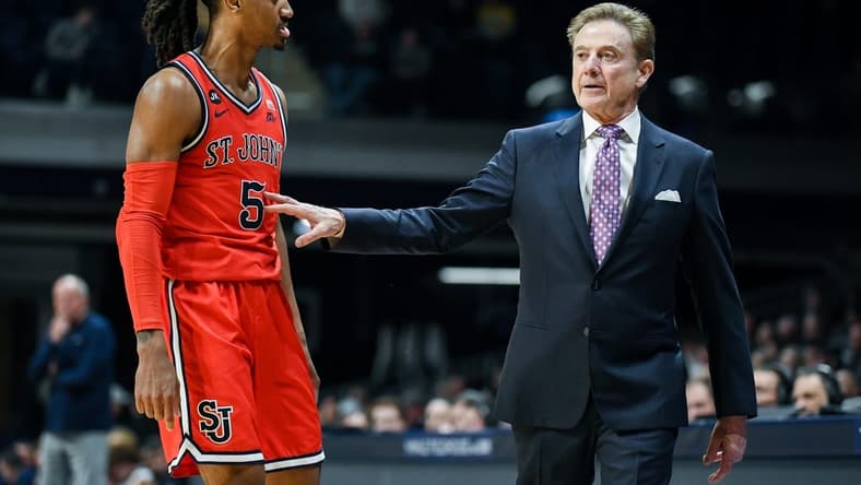 Feb 28, 2024; Indianapolis, Indiana, USA; St. John's Red Storm guard Daniss Jenkins (5) talks with St. John's Red Storm head coach Rick Pitino during the second half at Hinkle Fieldhouse. Mandatory Credit: Robert Goddin-USA TODAY Sports