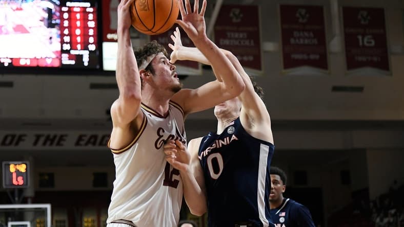 Feb 28, 2024; Chestnut Hill, Massachusetts, USA; Boston College Eagles forward Quinten Post (12) shoots the ball against Virginia Cavaliers forward Blake Buchanan (0) during the second half at Conte Forum. Mandatory Credit: Eric Canha-USA TODAY Sports