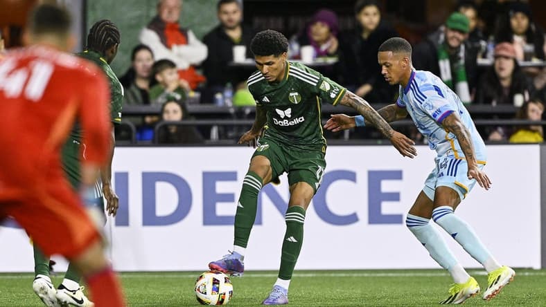 Feb 24, 2024; Oregon, Oregon, USA; Portland Timbers forward Antony (11) controls the ball during the second half against Colorado Rapids forward Calvin Harris (14) at Providence Park. Mandatory Credit: Troy Wayrynen-USA TODAY Sports