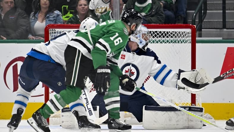 Feb 29, 2024; Dallas, Texas, USA; Dallas Stars center Joe Pavelski (16) scores a goal past Winnipeg Jets goaltender Connor Hellebuyck (37) during the first period at the American Airlines Center. Mandatory Credit: Jerome Miron-USA TODAY Sports