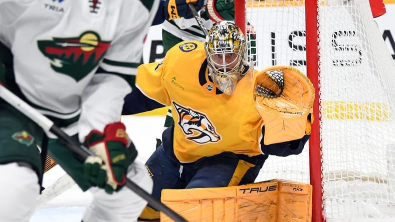 Feb 29, 2024; Nashville, Tennessee, USA; Nashville Predators goaltender Juuse Saros (74) watches the puck as it is played in the corner during the second period against the Minnesota Wild at Bridgestone Arena. Mandatory Credit: Christopher Hanewinckel-USA TODAY Sports