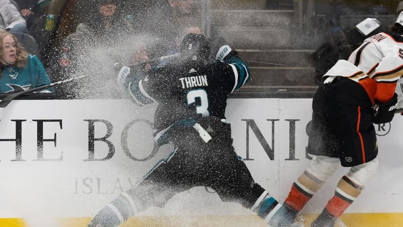 Feb 29, 2024; San Jose, California, USA; San Jose Sharks defenseman Henry Thrun (3) collides into the wall during the first period against the Anaheim Ducks at SAP Center at San Jose. Mandatory Credit: Stan Szeto-USA TODAY Sports