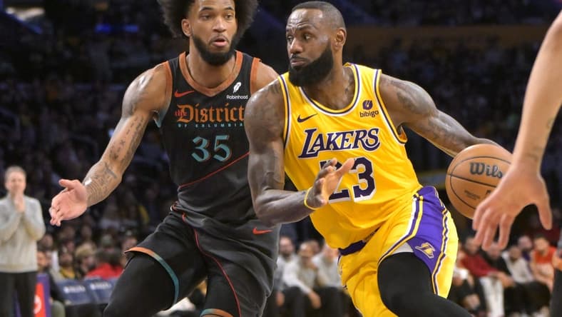 Feb 29, 2024; Los Angeles, California, USA; Washington Wizards forward Marvin Bagley III (35) guards Los Angeles Lakers forward LeBron James (23) in the first half at Crypto.com Arena. Mandatory Credit: Jayne Kamin-Oncea-USA TODAY Sports