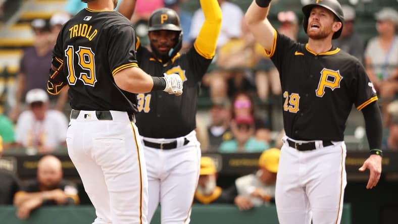 Mar 1, 2024; Bradenton, Florida, USA; Pittsburgh Pirates third baseman Jared Triolo (19) is congratulated after he hit a 3-run home run during the second inning against the Tampa Bay Rays at LECOM Park. Mandatory Credit: Kim Klement Neitzel-USA TODAY Sports