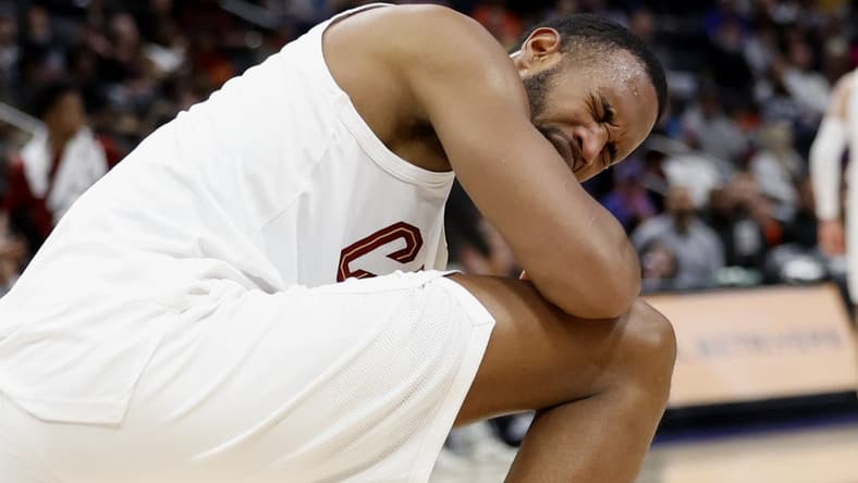 Mar 1, 2024; Detroit, Michigan, USA; Cleveland Cavaliers forward Evan Mobley (4) reacts after he is poked in the eye in the first half against the Detroit Pistons at Little Caesars Arena. Mandatory Credit: Rick Osentoski-USA TODAY Sports