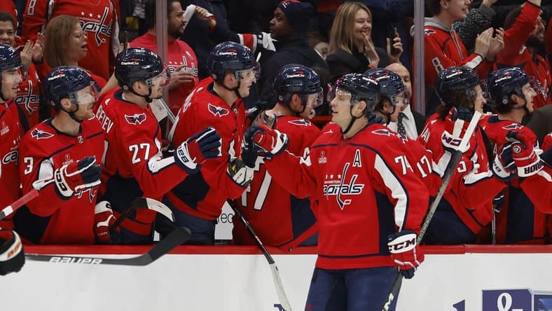 Mar 1, 2024; Washington, District of Columbia, USA; Washington Capitals defenseman John Carlson (74) celebrates with teammates after scoring a goal against the Philadelphia Flyers in the second period at Capital One Arena. Mandatory Credit: Geoff Burke-USA TODAY Sports