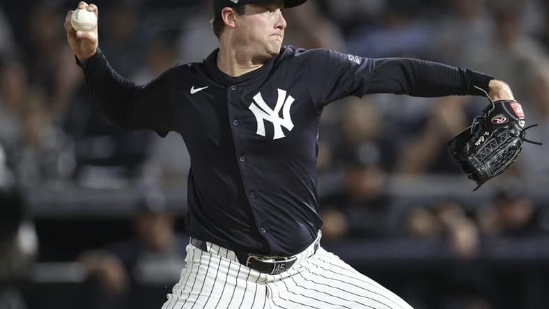 Mar 1, 2024; Tampa, Florida, USA; New York Yankees starting pitcher Gerrit Cole (45) throws a pitch against the Toronto Blue Jays in the first inning at George M. Steinbrenner Field. Mandatory Credit: Nathan Ray Seebeck-USA TODAY Sports