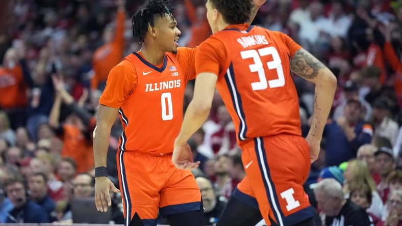 Mar 2, 2024; Madison, Wisconsin, USA; Illinois Fighting Illini guard Terrence Shannon Jr. (0) celebrates scoring a three-point basket with teammate Illinois Fighting Illini forward Coleman Hawkins (33) during the first half against the Wisconsin Badgers at the Kohl Center. Mandatory Credit: Kayla Wolf-USA TODAY Sports