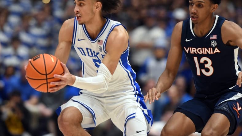 Mar 2, 2024; Durham, North Carolina, USA; Duke Blue Devils guard Tyrese Proctor (5) tracks down a loose ball in front of Virginia Cavaliers guard Ryan Dunn (13) during the first half at Cameron Indoor Stadium. Mandatory Credit: Rob Kinnan-USA TODAY Sports