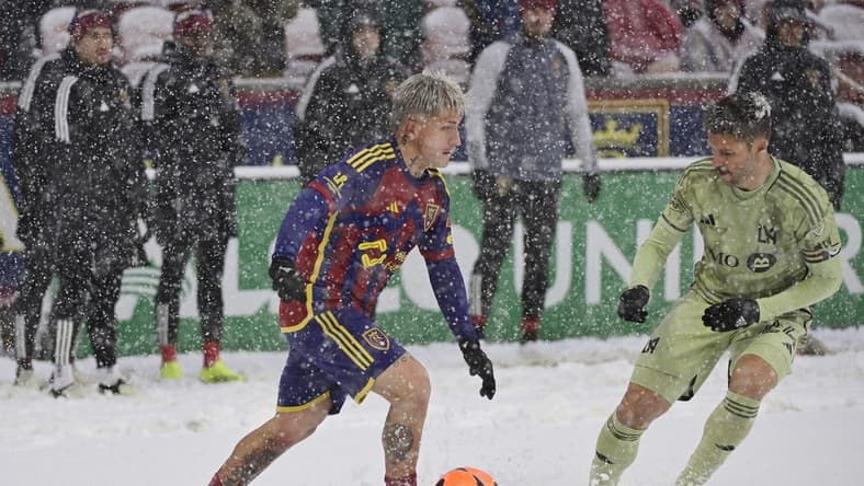 Mar 2, 2024; Sandy, Utah, USA; Real Salt Lake midfielder Diego Luna (8) is defended by LAFC defender Ryan Hollingshead (24) at America First Field. Mandatory Credit: Christopher Creveling-USA TODAY Sports