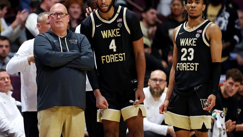 Mar 2, 2024; Blacksburg, Virginia, USA; Wake Forest Demon Deacons head coach Steve Forbes talks with Wake Forest Demon Deacons forward Efton Reid III (4) and guard Hunter Sallis (23) during the second half of the game against the Virginia Tech Hokies at Cassell Coliseum. Mandatory Credit: Peter Casey-USA TODAY Sports