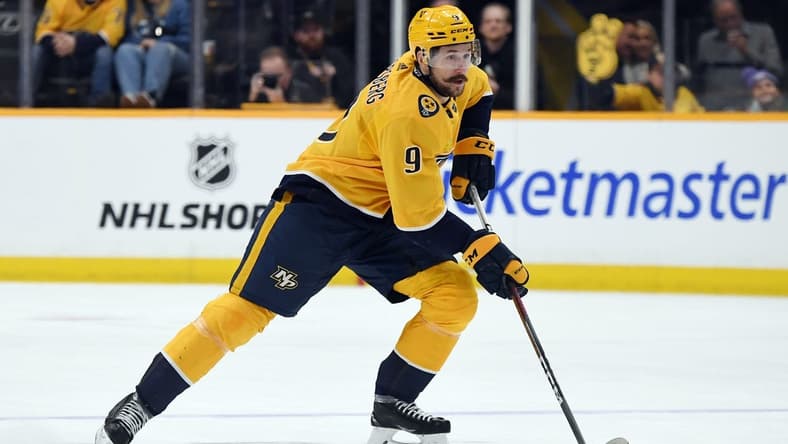 Mar 2, 2024; Nashville, Tennessee, USA; Nashville Predators left wing Filip Forsberg (9) skates with the puck during the first period against the Colorado Avalanche at Bridgestone Arena. Mandatory Credit: Christopher Hanewinckel-USA TODAY Sports