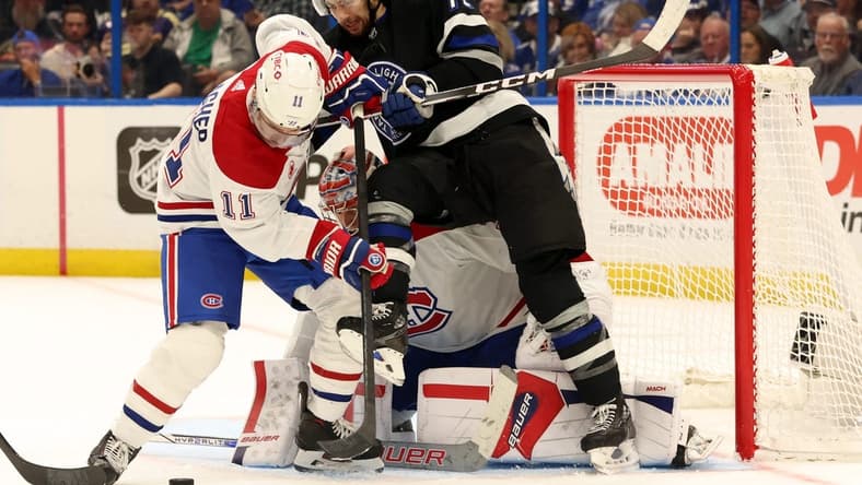 Mar 2, 2024; Tampa, Florida, USA;  Montreal Canadiens right wing Brendan Gallagher (11) and goaltender Cayden Primeau (30) defends Tampa Bay Lightning center Anthony Cirelli (71) during the first period at Amalie Arena. Mandatory Credit: Kim Klement Neitzel-USA TODAY Sports