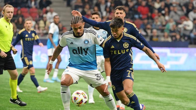 Mar 2, 2024; Vancouver, British Columbia, CAN; Charlotte FC defender Jere Uronen (3) and Vancouver Whitecaps FC midfielder Ryan Raposo (7) race after the ball during the first half at BC Place. Mandatory Credit: Anne-Marie Sorvin-USA TODAY Sports