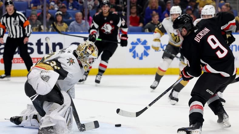 Mar 2, 2024; Buffalo, New York, USA;  Vegas Golden Knights goaltender Logan Thompson (36) looks to make a save on Buffalo Sabres left wing Zach Benson (9) during the second period at KeyBank Center. Mandatory Credit: Timothy T. Ludwig-USA TODAY Sports