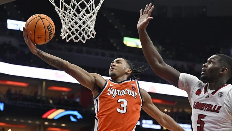 Mar 2, 2024; Louisville, Kentucky, USA; Syracuse Orange guard Judah Mintz (3) shoots against Louisville Cardinals forward Brandon Huntley-Hatfield (5) during the first half at KFC Yum! Center. Mandatory Credit: Jamie Rhodes-USA TODAY Sports
