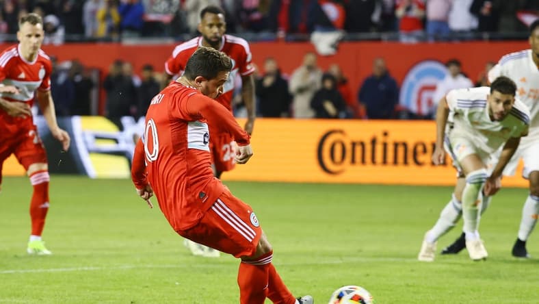 Mar 2, 2024; Chicago, Illinois, USA; Chicago Fire FC midfielder Xherdan Shaqiri (10) kicks and scores a goal against the FC Cincinnati in the first half at Soldier Field. Mandatory Credit: Mike Dinovo-USA TODAY Sports