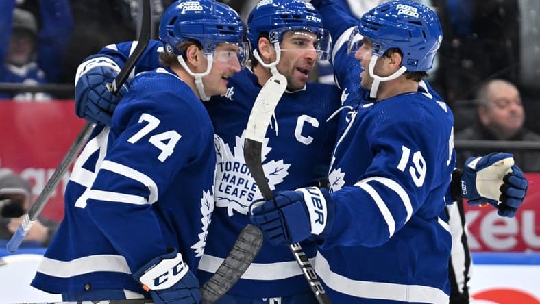 Mar 2, 2024; Toronto, Ontario, CAN;  Toronto Maple Leafs forward John Tavares (91) celebrates with forwards Bobby McMann (74) and Calle Jarnkrok (19) after scoring against the New York Rangers in the third period at Scotiabank Arena. Mandatory Credit: Dan Hamilton-USA TODAY Sports