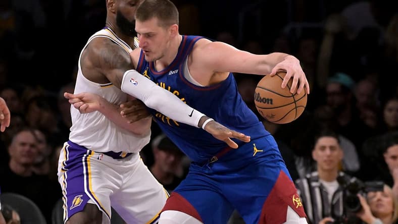 Mar 2, 2024; Los Angeles, California, USA; Los Angeles Lakers forward LeBron James (23) guards Denver Nuggets center Nikola Jokic (15) in the second half at Crypto.com Arena. Mandatory Credit: Jayne Kamin-Oncea-USA TODAY Sports