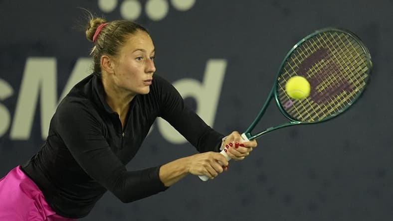 Mar 2, 2024; San Diego, CA, USA; Marta Kostyuk of Ukraine hits a backhand against Jessica Pegula of the United States (not pictured) during the second set of the semifinals of the San Diego Open at Barnes Tennis Center. Mandatory Credit: Ray Acevedo-USA TODAY Sports