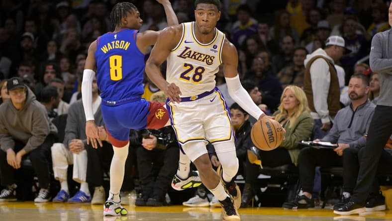 Mar 2, 2024; Los Angeles, California, USA; Los Angeles Lakers forward Rui Hachimura (28) drives past Denver Nuggets guard Christian Braun (0) in the second half at Crypto.com Arena. Mandatory Credit: Jayne Kamin-Oncea-USA TODAY Sports