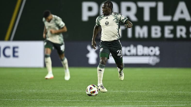 Mar 2, 2024; Portland, Oregon, USA; Portland Timbers midfielder Diego Chara (21) controls the ball during the second half against D.C. United at Providence Park. Mandatory Credit: Troy Wayrynen-USA TODAY Sports
