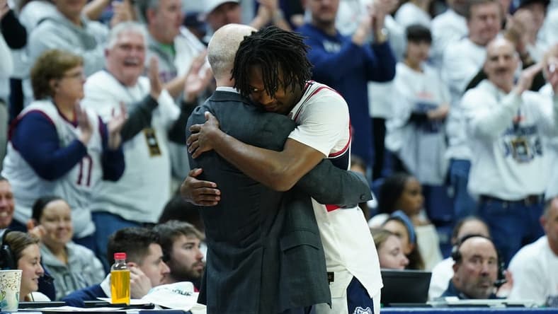 Mar 3, 2024; Storrs, Connecticut, USA; UConn Huskies head coach Dan Hurley hugs guard Tristen Newton (2) as he comes off the court during his final home game as they take on the Seton Hall Pirates at Harry A. Gampel Pavilion. Mandatory Credit: David Butler II-USA TODAY Sports