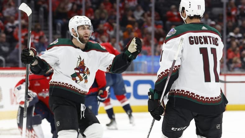 Mar 3, 2024; Washington, District of Columbia, USA; Arizona Coyotes left wing Jason Zucker (16) celebrates with Coyotes right wing Dylan Guenther (11) after scoring a goal against the Washington Capitals in the second period at Capital One Arena. Mandatory Credit: Geoff Burke-USA TODAY Sports